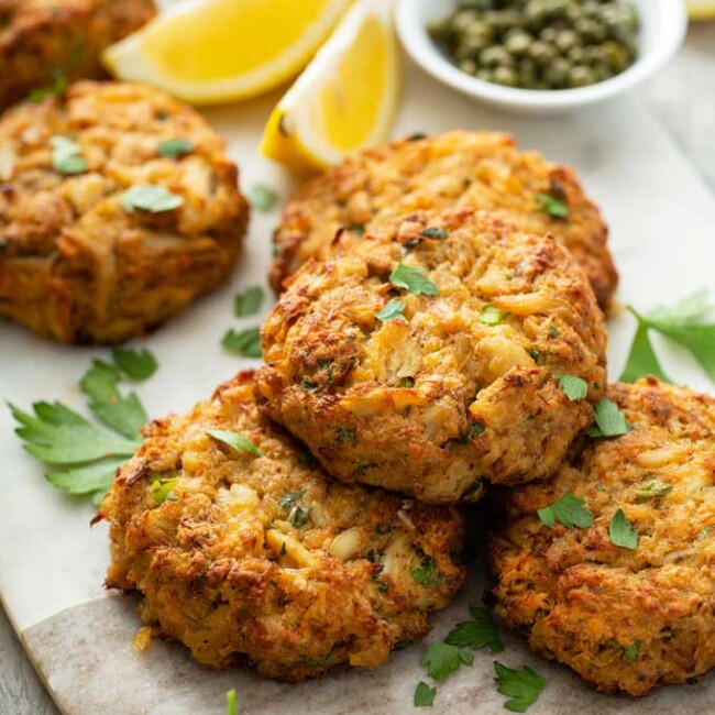 Crispy Golden brown Maryland style crab cakes on a marble surface