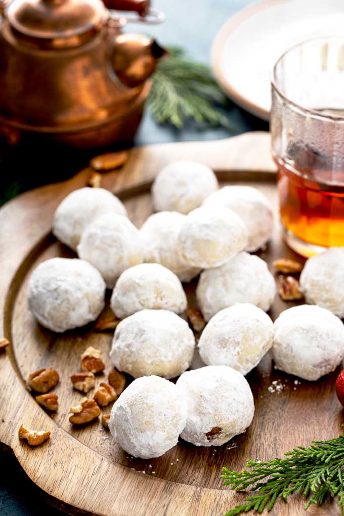 Snowball cookies on a wooden plate