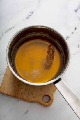 Small saucepan with honey syrup ingredients