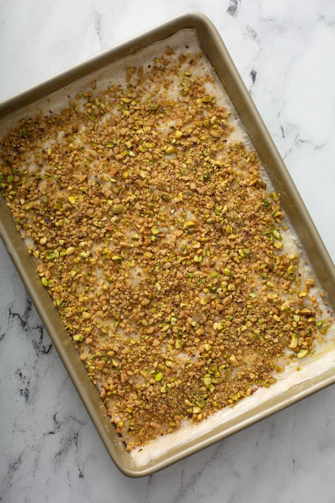 Finely chopped walnuts and pistachios over a layer of phyllo dough