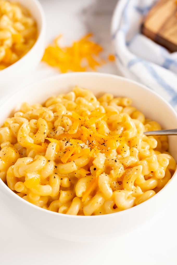 A white bowl of instant pot mac and cheese 