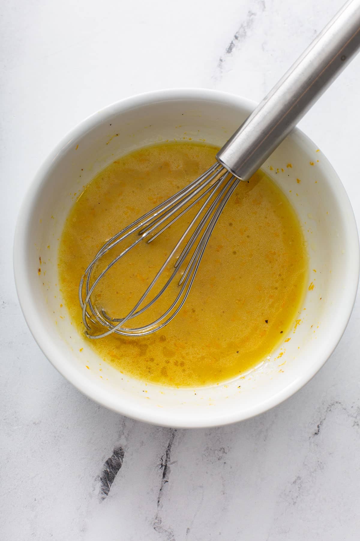 Orange Salad Dressing in a white bowl