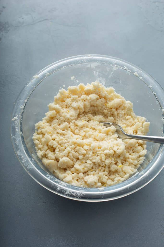 flour, sugar, butter and lemon zest combined in a bowl
