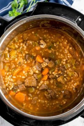 top view of an instant pot with beef and barley soup