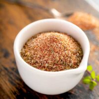 A white bowl filled with homemade cajun seasoning mix