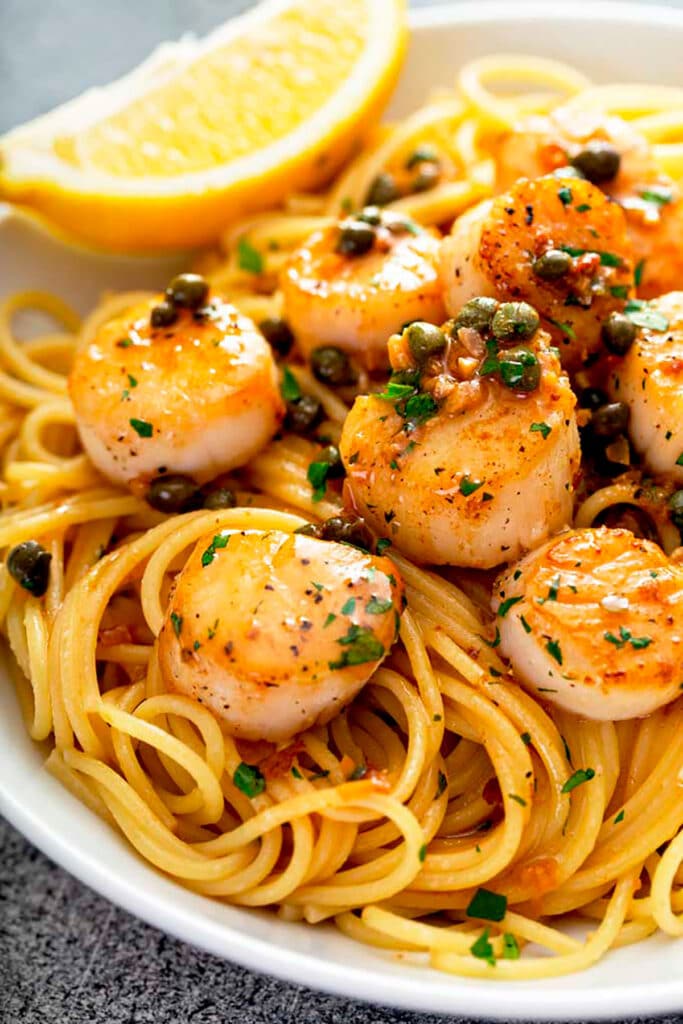 Close up view of Seared Scallops over pasta