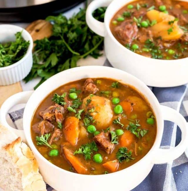 Two white bowls with beef stew