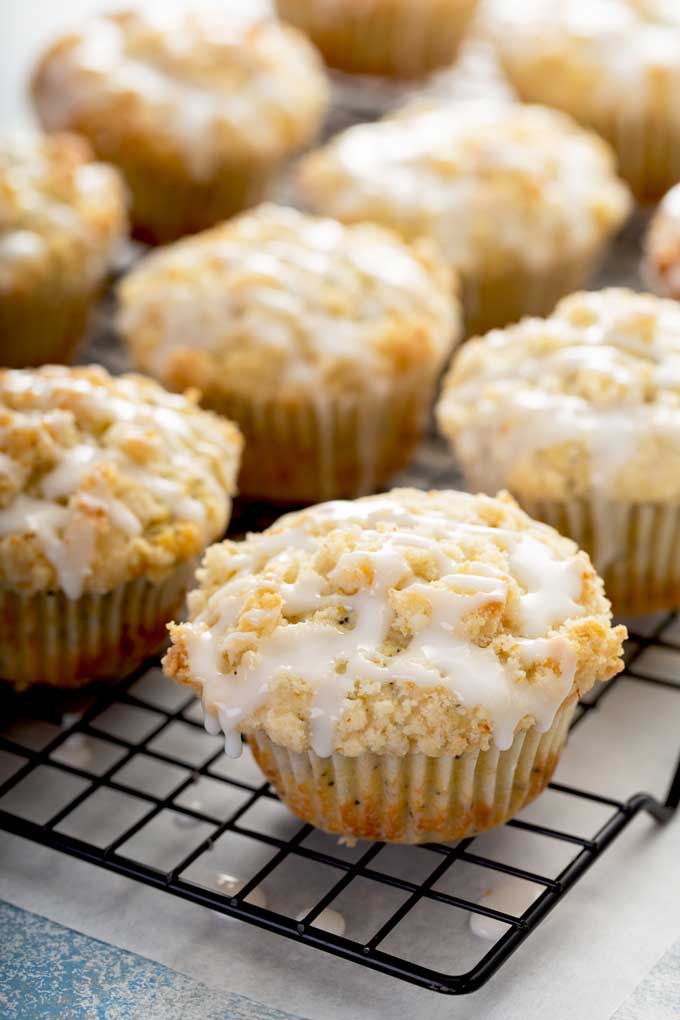 Glazed muffins on a cooling rack.