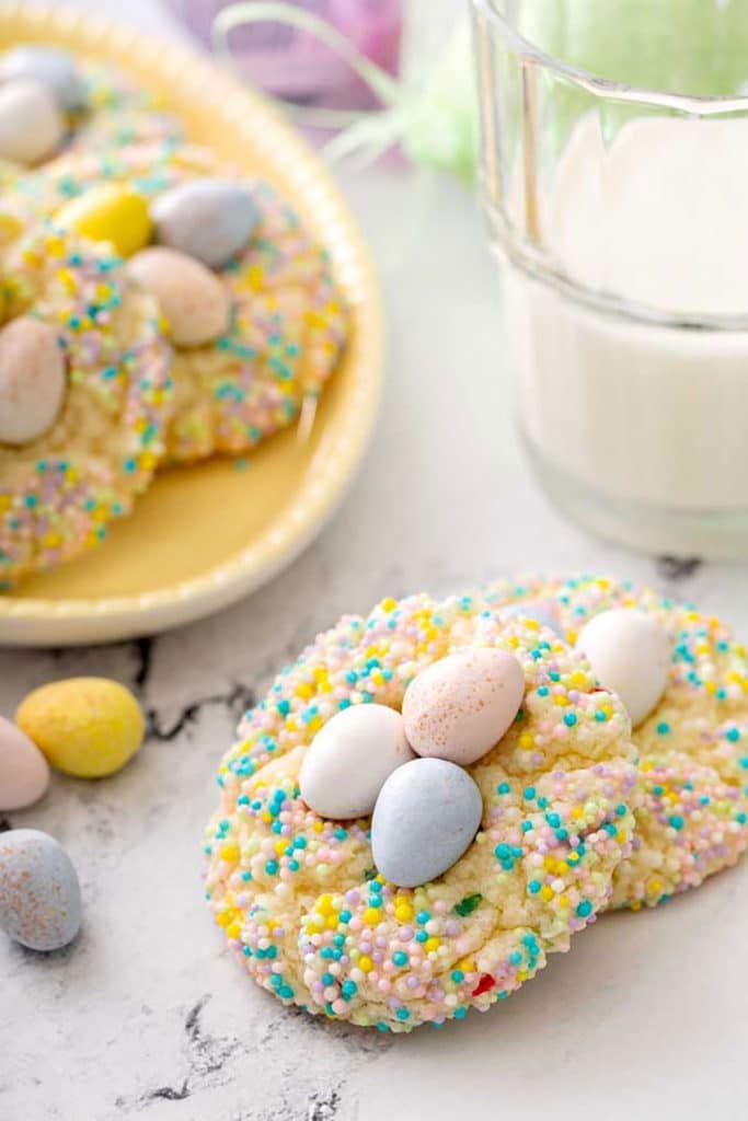 Two easter cookies on a white marble surface
