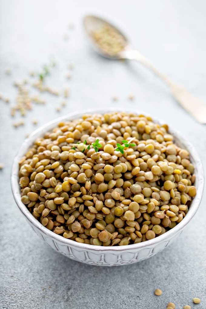 cooked lentils on a white bowl