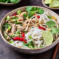 Vietnamese Chicken pho with rice noodles in a bowl
