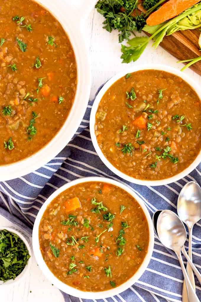 Bowls of lentil soup on a table