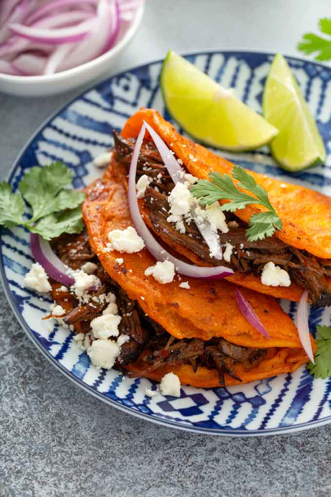 Two Mexican beef tacos on a plate