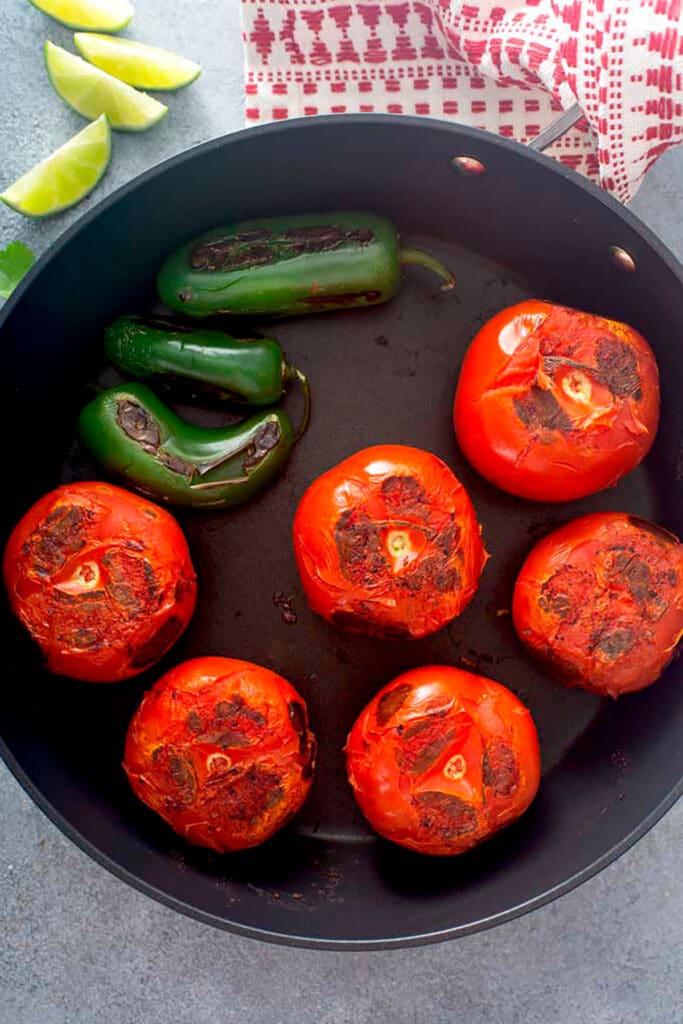 Chared Tomatoes and Chiles on a large cast iron skillet