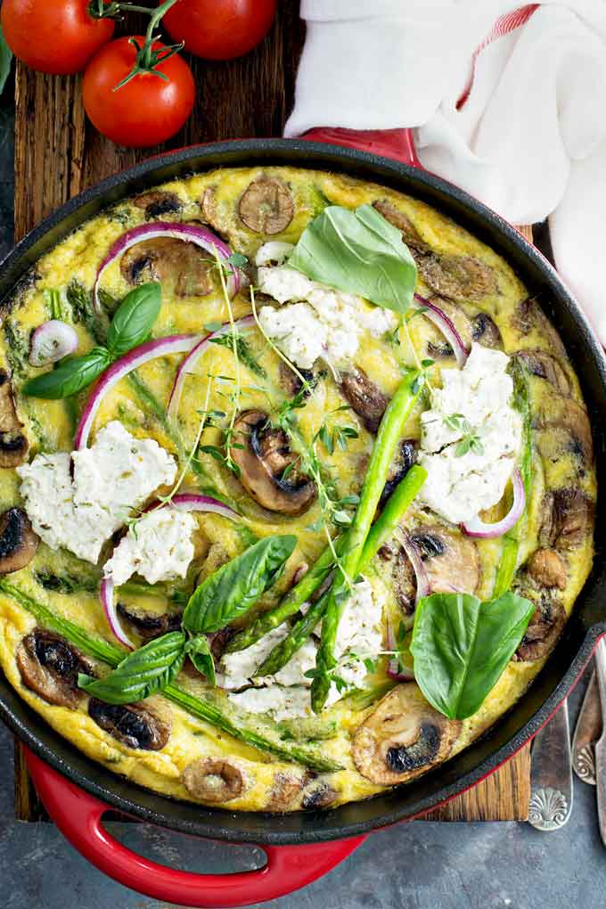 Top view of an asparagus, mushroom and goat cheese frittata