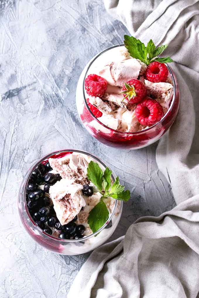 topped view of Eton Mess served in glasses.