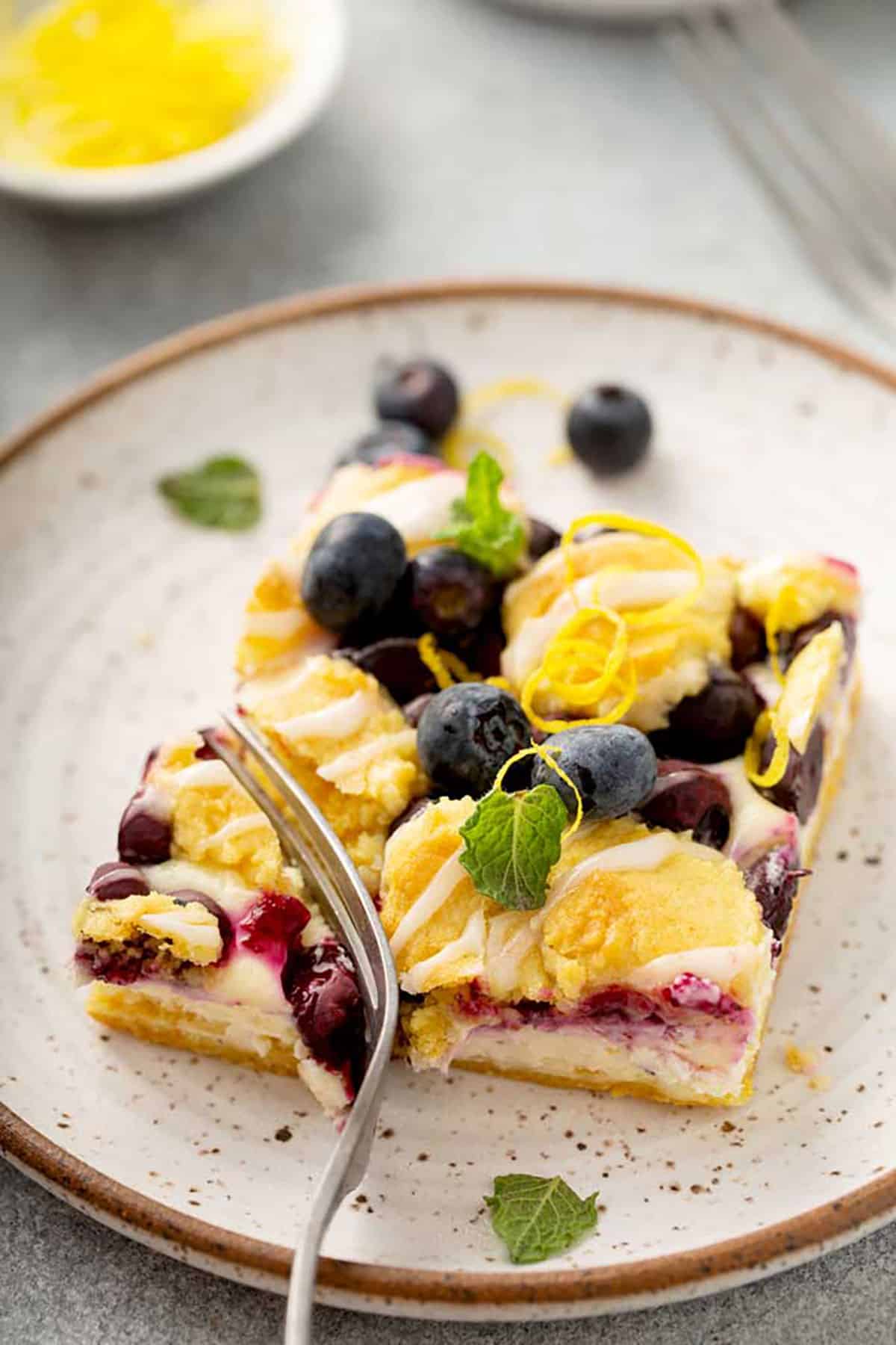 Cheesecake  and streusel blueberry lemon bar on a plate