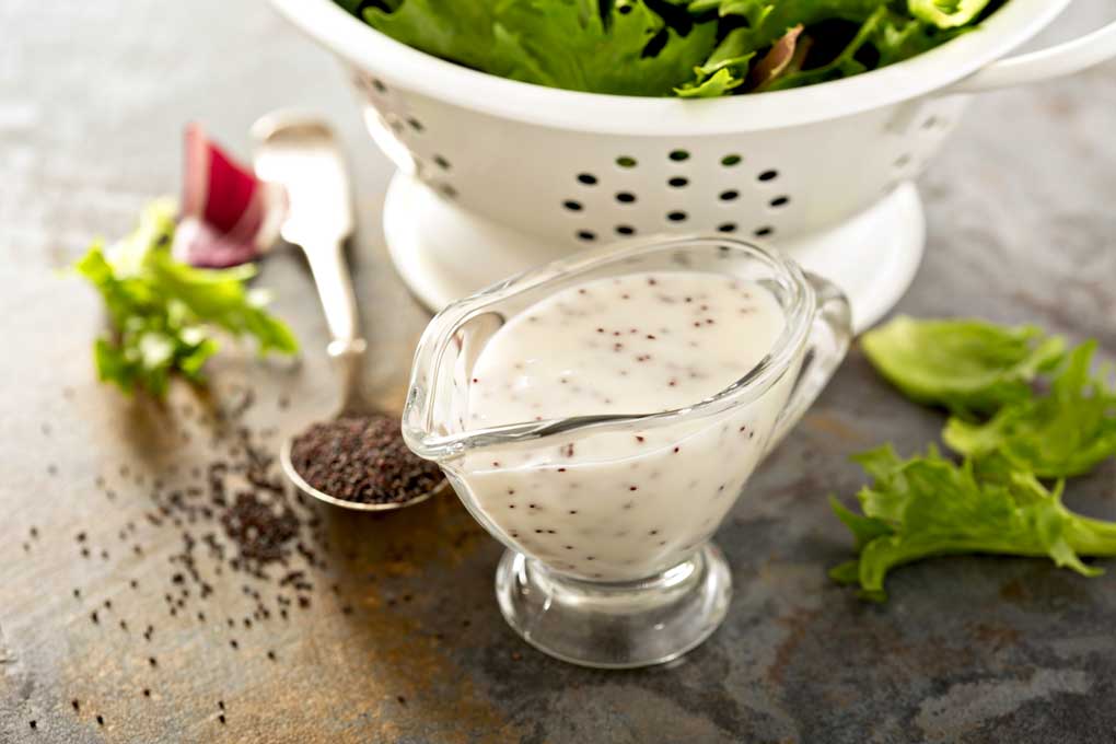 Poppy seeds dressing on a stone countertop
