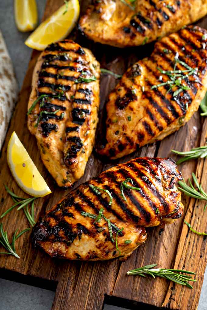 Grilled chicken breast on a cutting board