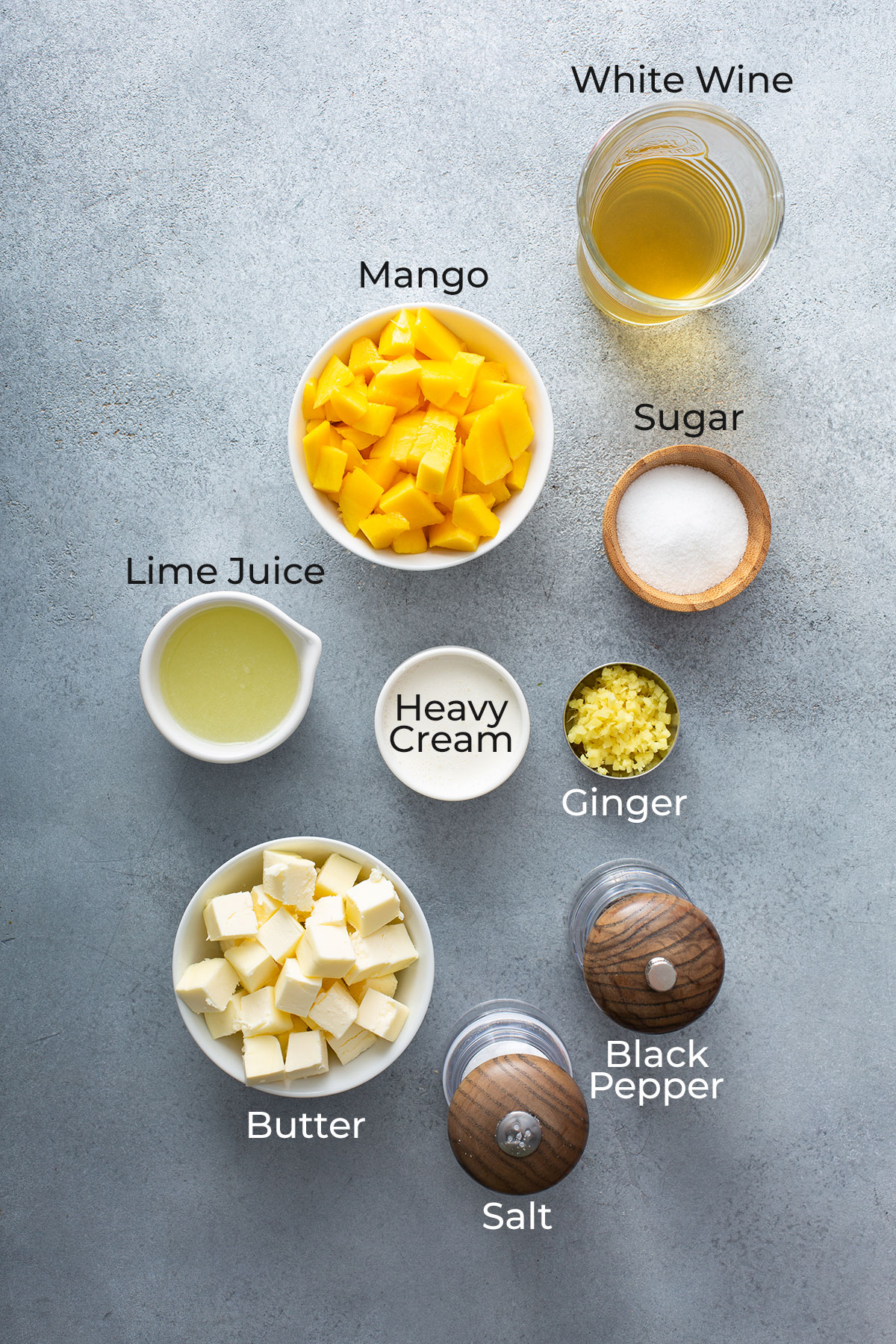 Ingredients to make mango butter wine sauce or mango lime beurre blanc