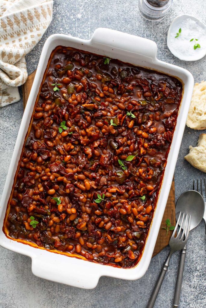Beans with bacon in a baking dish.