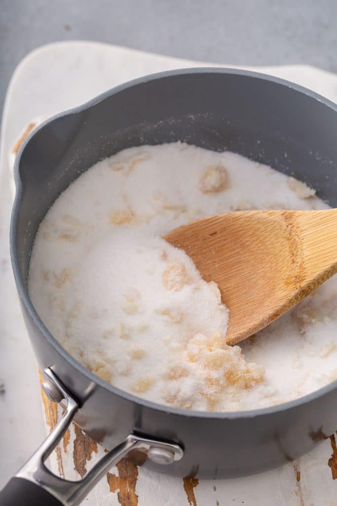 Sugar getting melted in a saucepan.