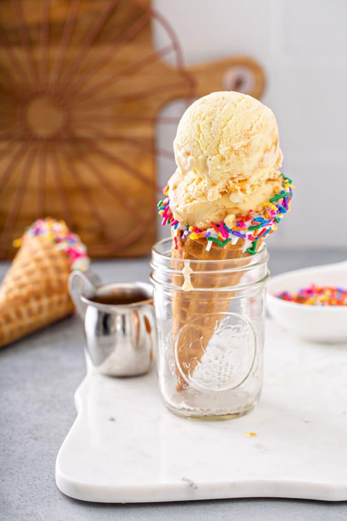 an sweet corn ice cream cone with sprinkles in a mason jar
