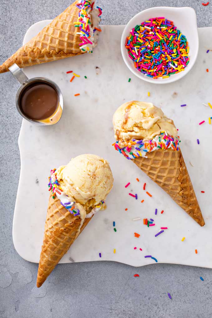 top view of 3 corn ice cream cones with sprinkles