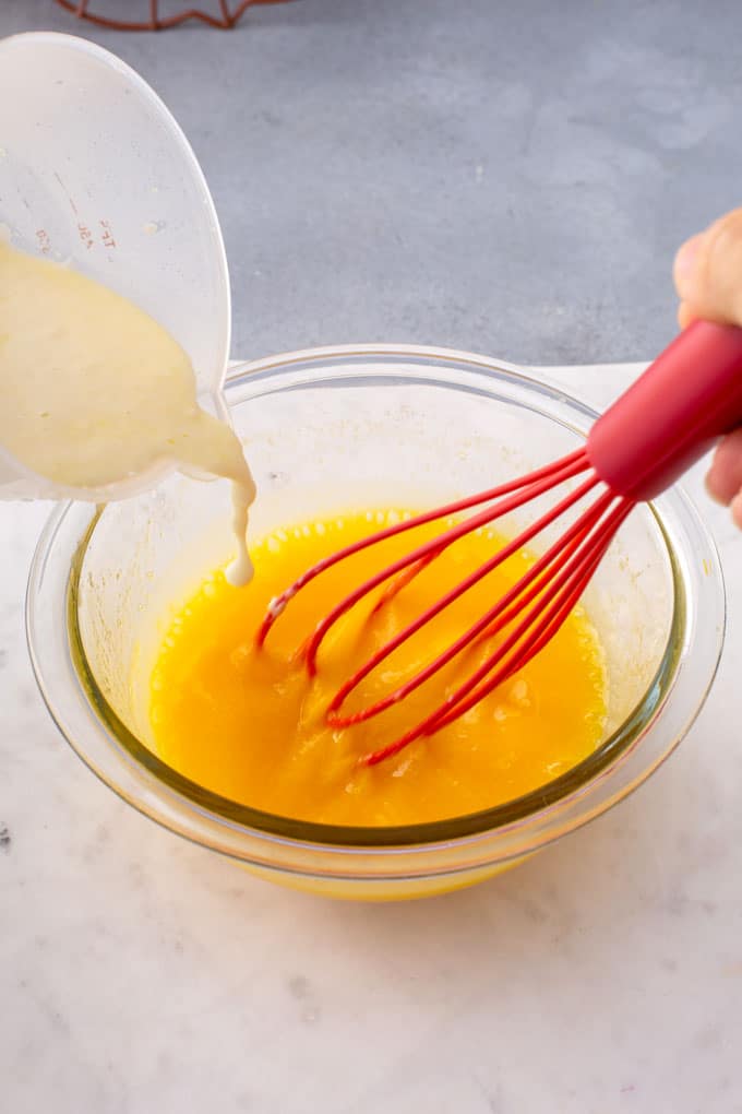Tempering egg yolks in a glass bowl