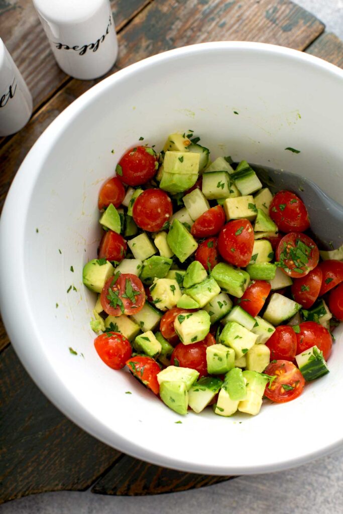 Chopped vegetable salad in a white bowl