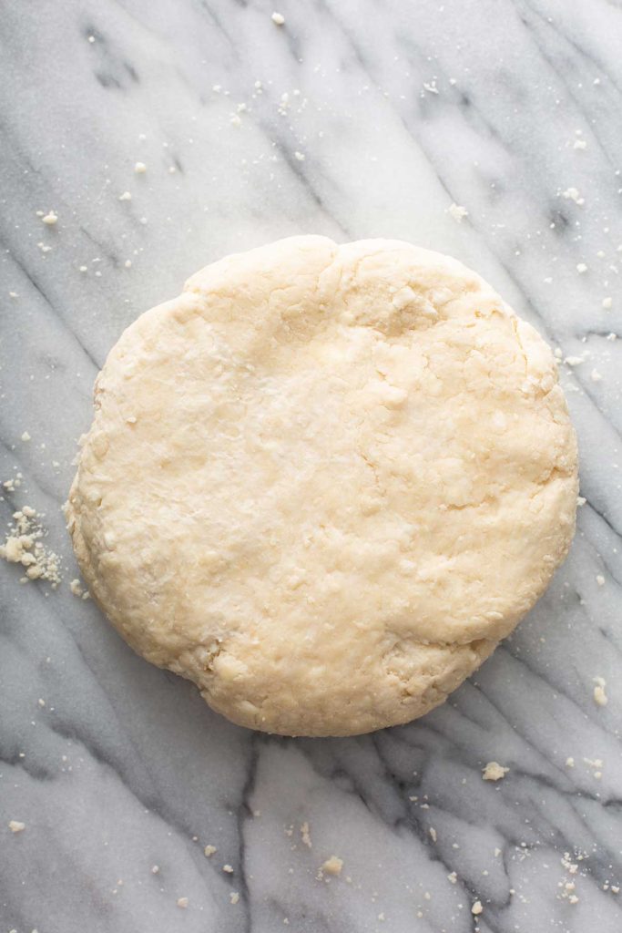 Pie Crust dough over a marble surface