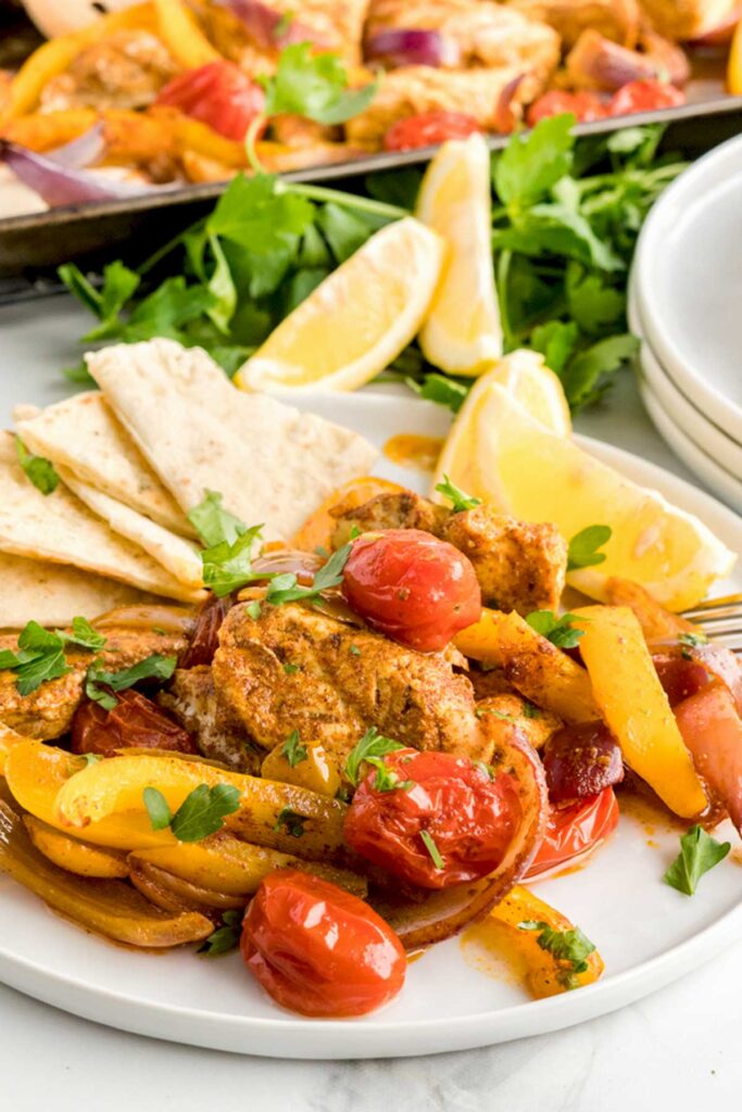 Pieces of shawarma chicken breast, blistered tomatoes, bell peppers and red onions served with pita bread.