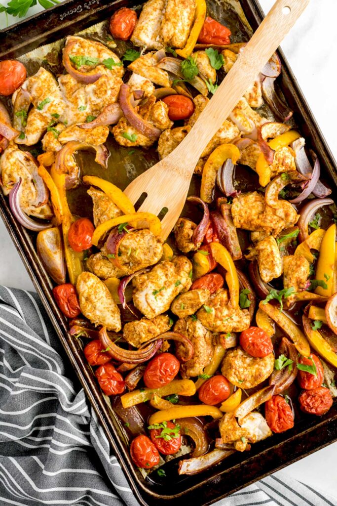 Oven Roasted Chicken Shawarma with Vegetables in a baking pan