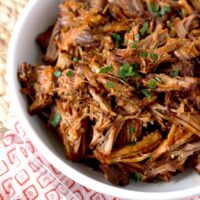 BBQ pulled pork made in the instant pot served in a white bowl