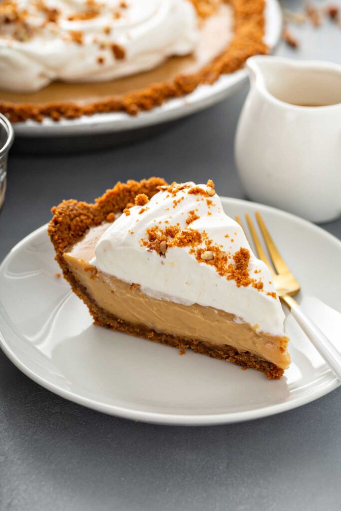 slice of butterscotch pie topped with whipped topping