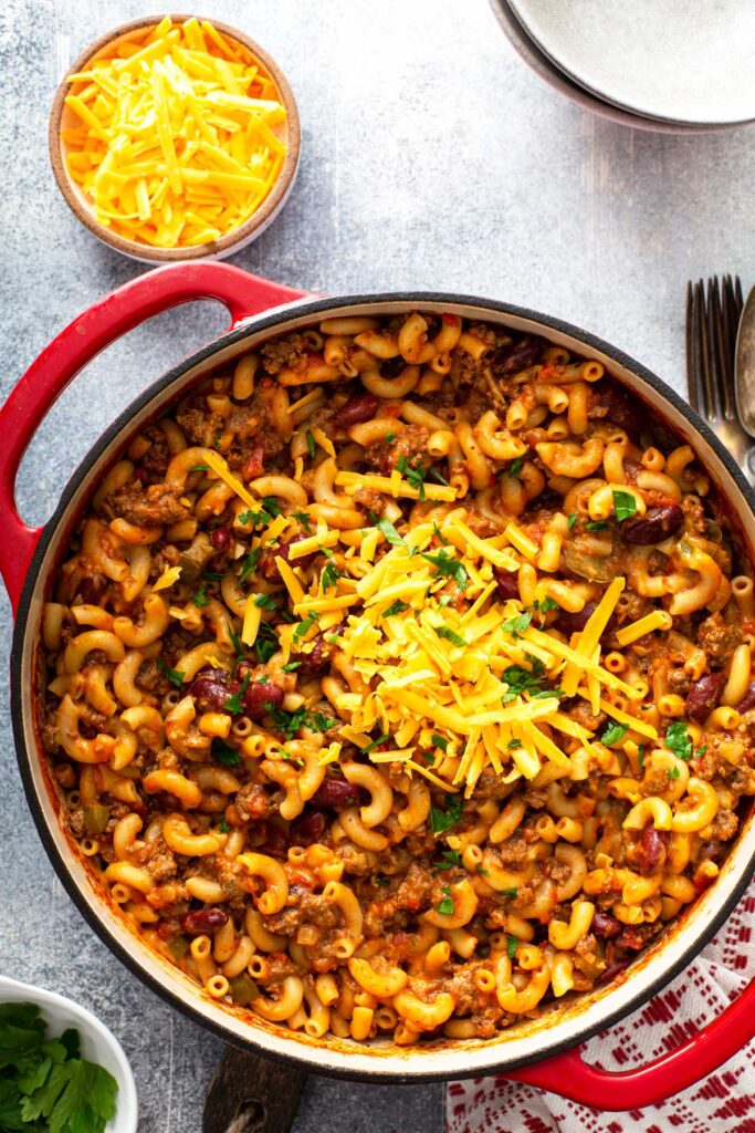Chili mac and cheese in a Dutch oven.