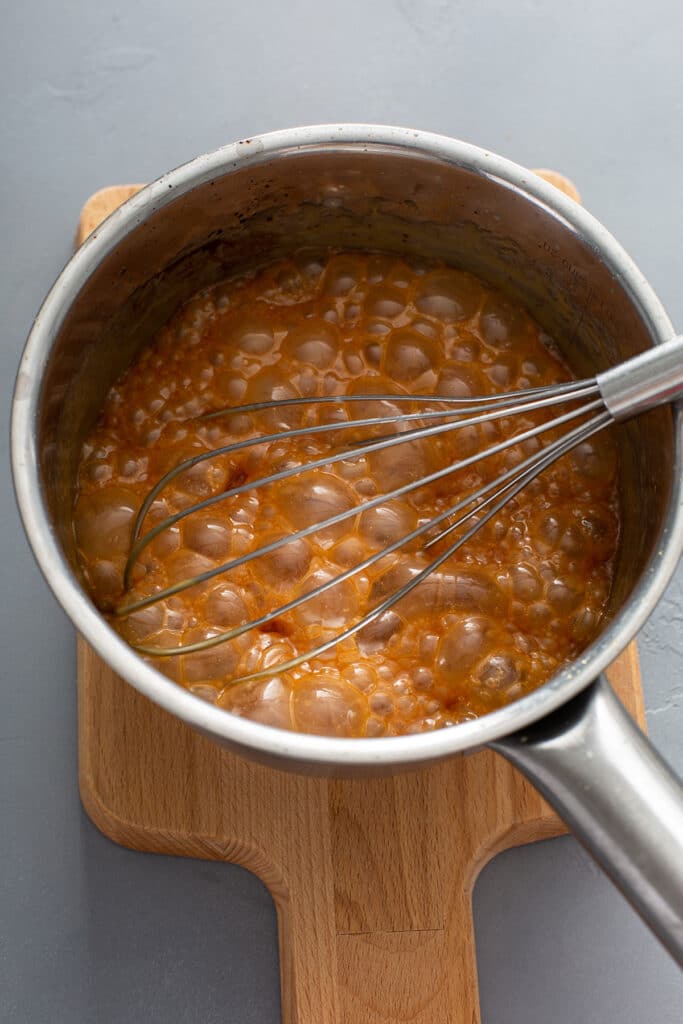 boiling caramel with a whisk