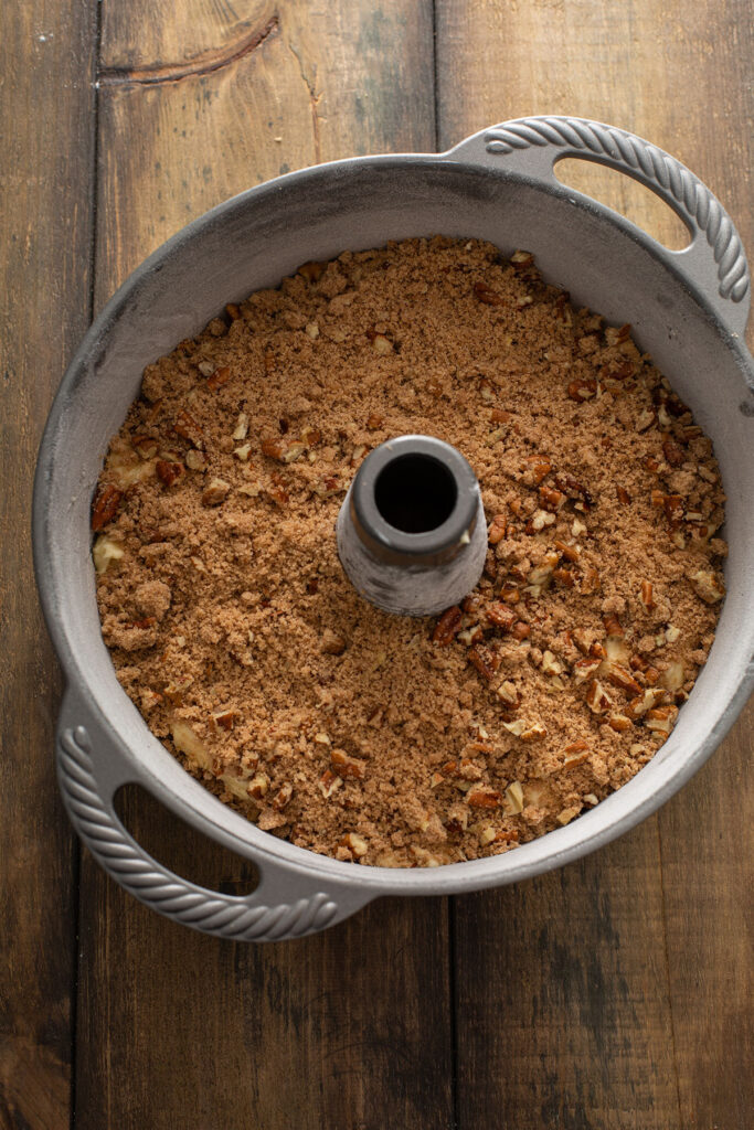 coffee cake batter with crumble on top in a baking pan