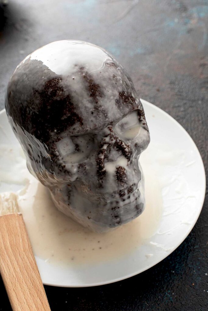 Chocolate cake skull covered with glazed.