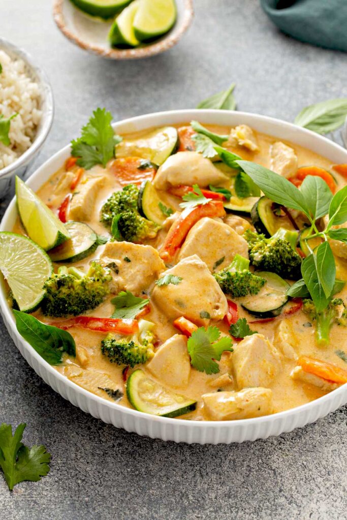 White plate with Thai curry and veggies