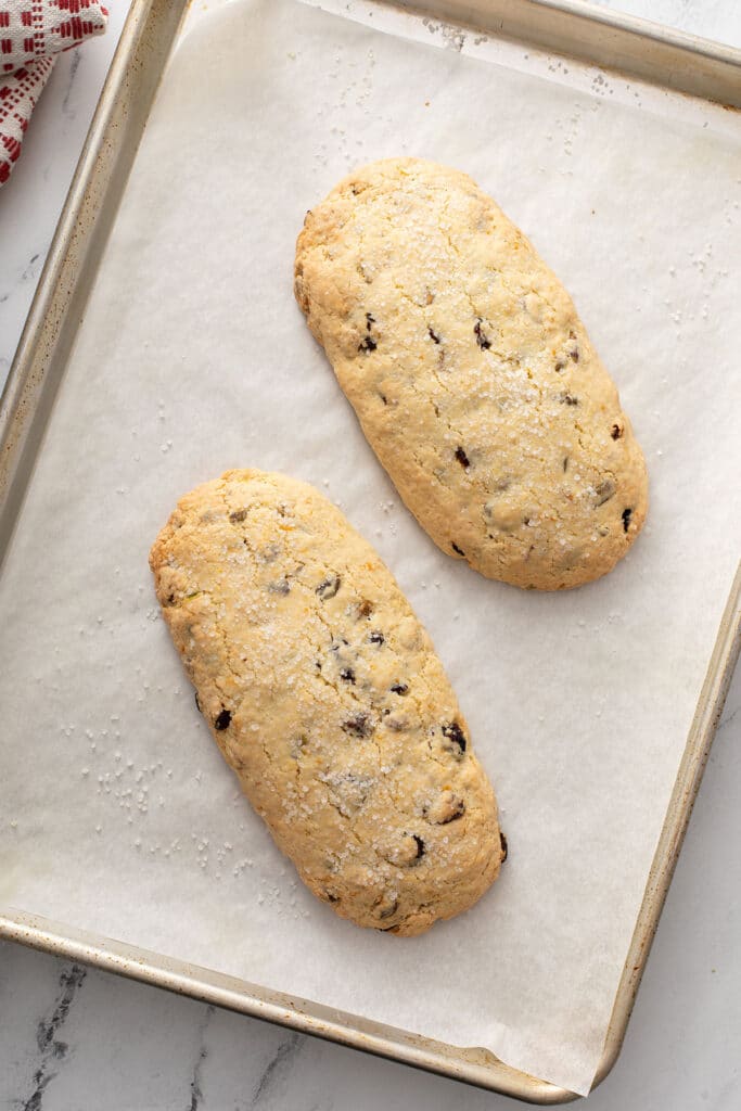 baked Biscotti logs on a sheet pan