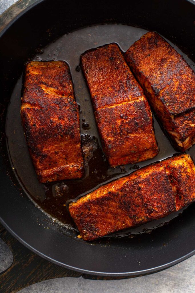 Pan seared Salmon Fillets in a skillet