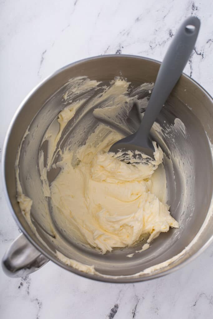 creamy butter whipped together to make chocolate buttercream icing 