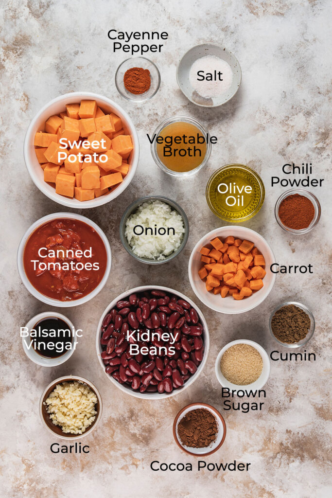 Ingredients to make vegetarian chili with sweet potatoes and beans.