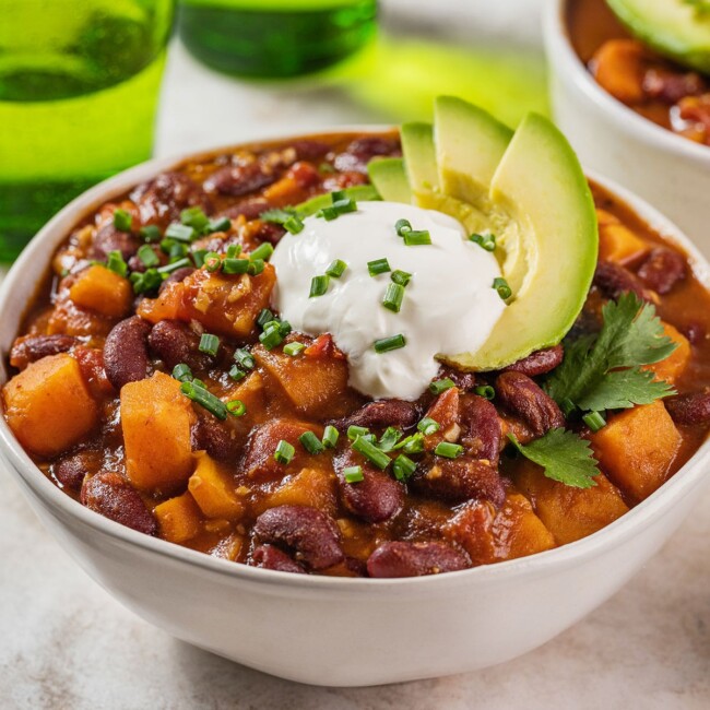 Bowl filled with sweet potato and bean vegetarian chili.