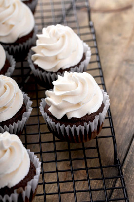 Guinness Chocolate Cupcakes with irish cream frosting on a cooling rack