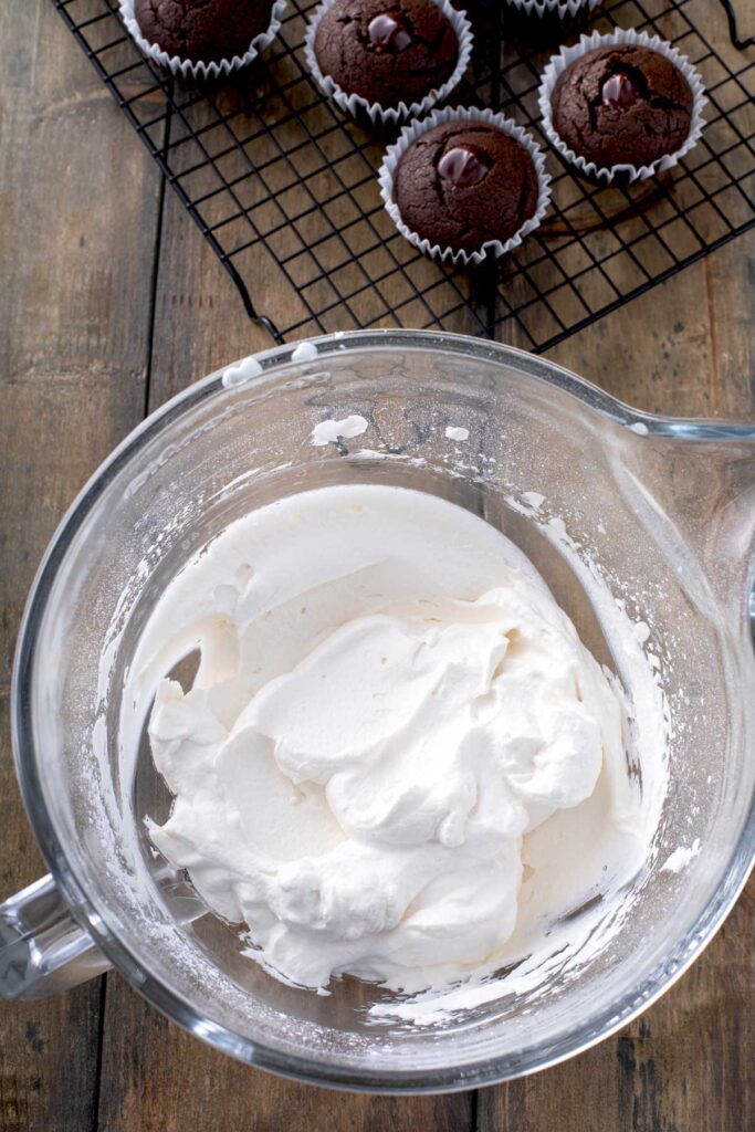 Fluffy Irish cream whipped cream frosting in a glass bowl