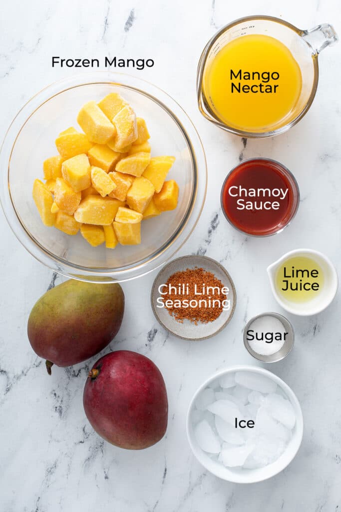 Ingredients to make a refreshing frozen mangonada smoothie 
