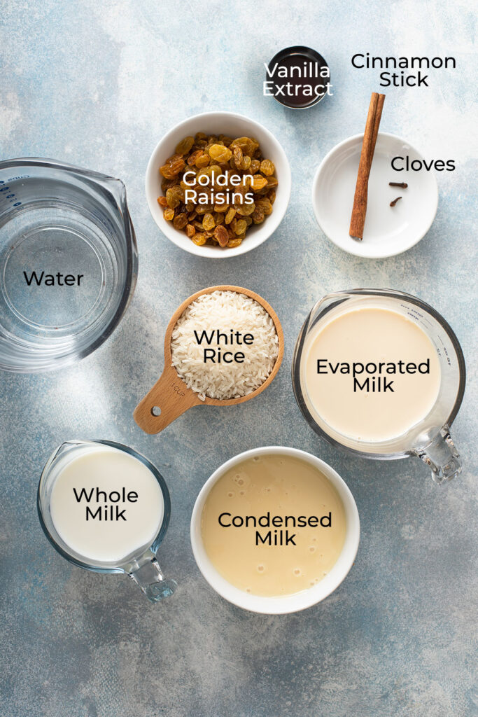 Ingredients to make rice pudding on a board