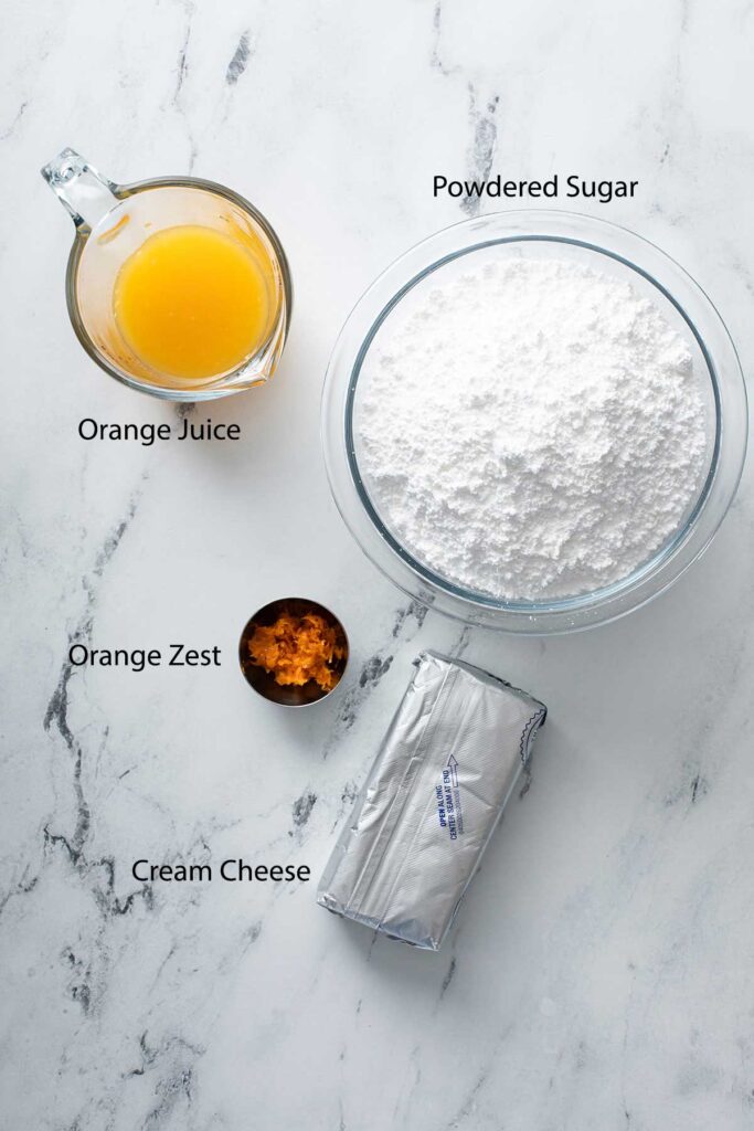 Ingredients to make the orange cream cheese glaze for the Easter breakfast bunny rolls
